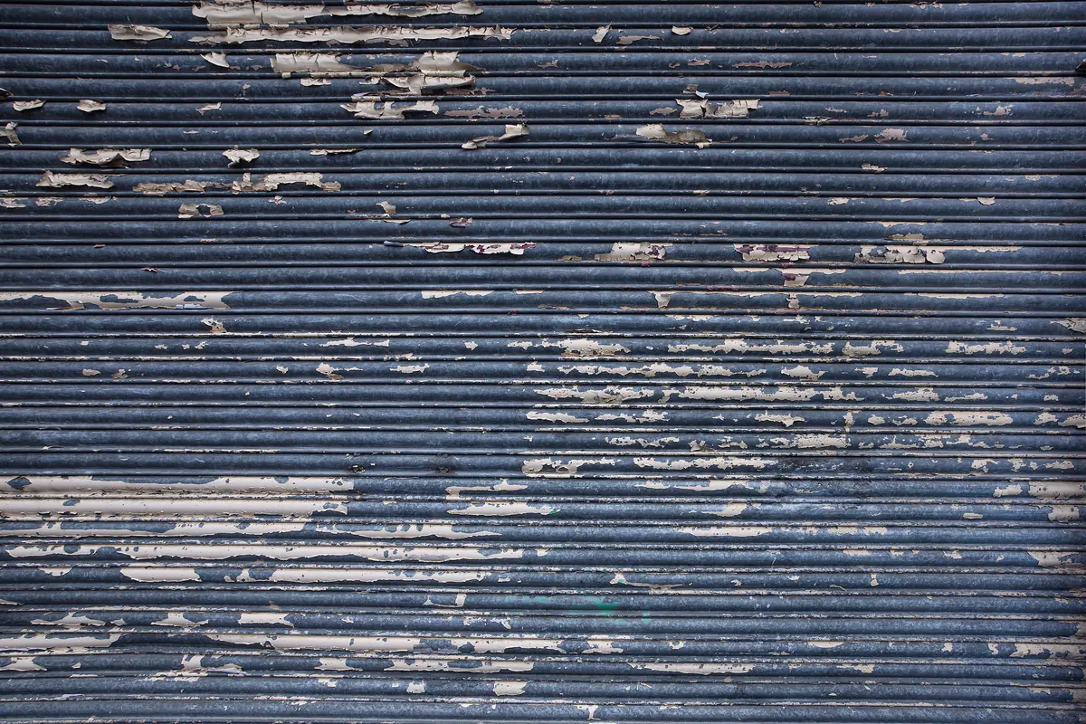 Weathered painted garage-door surface