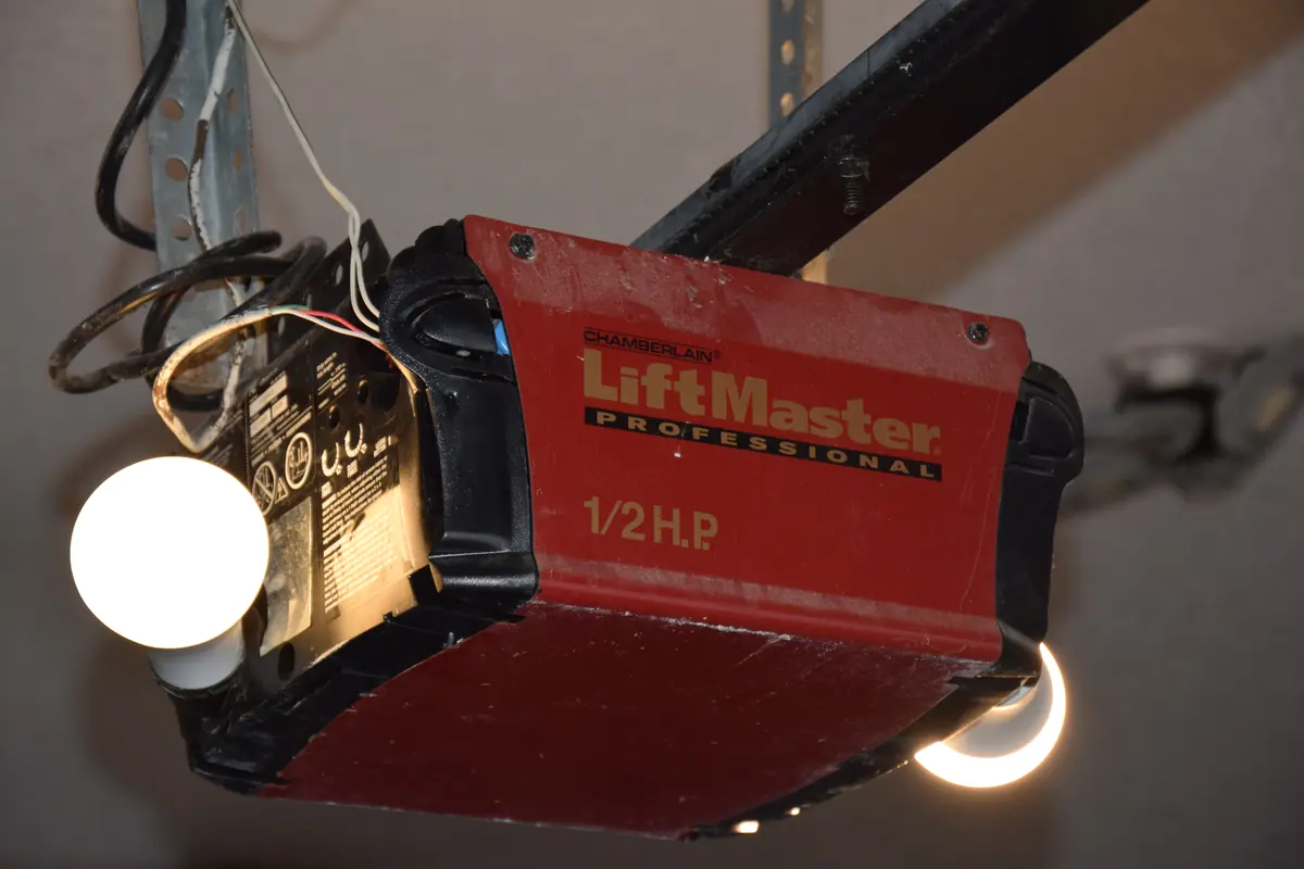 Ceiling-mounted garage-door operator and rail